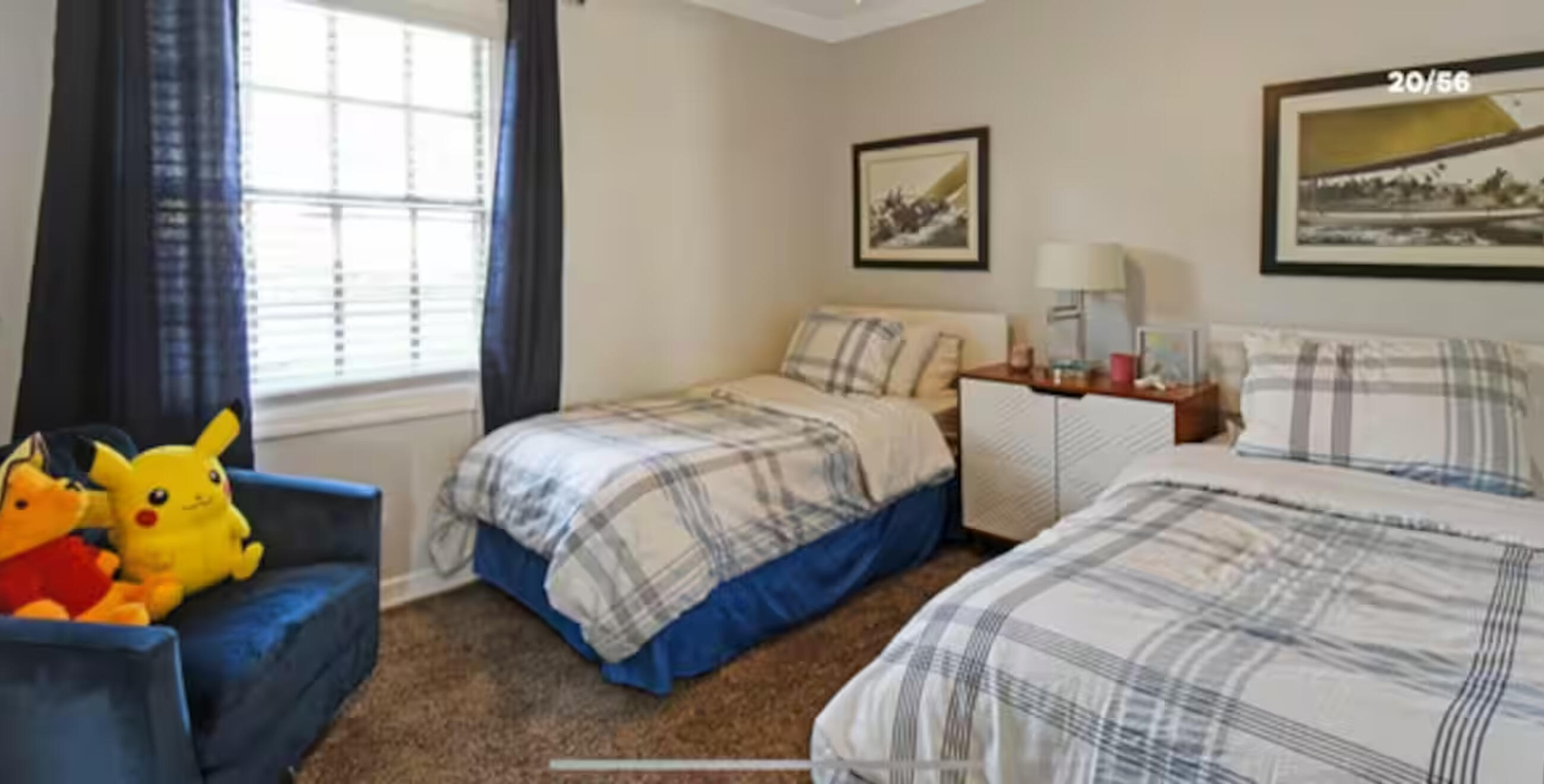 Spacious second bedroom with waterfront views and natural light